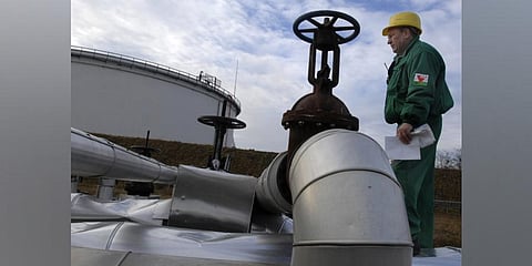 An Engineer of the Hungarian Oil and Gas Company (MOL) checks the receiving area of the Druzhba oil pipeline in the country's largest oil refinery in Szazhalombata, south of Budapest. (Photo | AP)