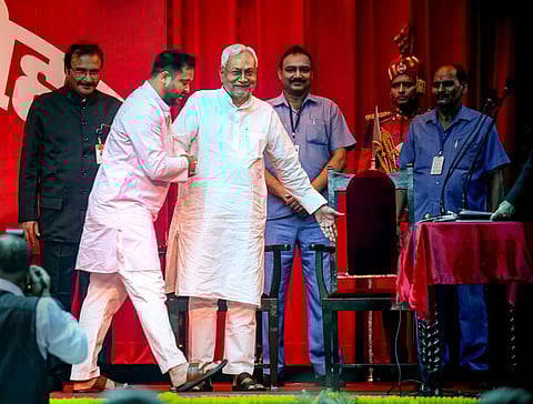 Bihar Chief Minister Nitish Kumar with his deputy Tejashwi Yadav during their swearing-in ceremony at the Raj Bhavan, in Patna. (Photo | PTI)