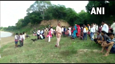 A boat with passengers from Fatehpur to Marka village was capsized around 3 pm on Thursday. (Photo | ANI Twitter)
