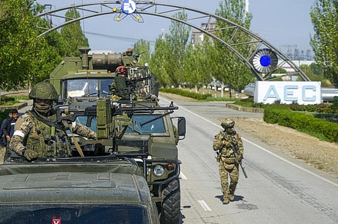 A Russian military convoy is seen on the road toward the Zaporizhzhia Nuclear Power Station, in Enerhodar, Zaporizhzhia region, in territory under Russian military control, Ukraine. (Photo| AP)