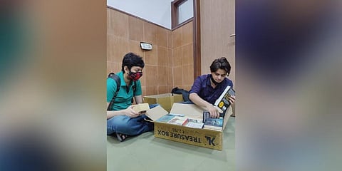 Visitors load their books in the box.