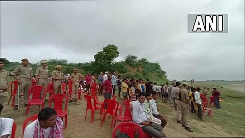 Search operation underway for missing people after a boat capsized in Yamuna river on Thursday evening. (Photo | ANI Twitter)