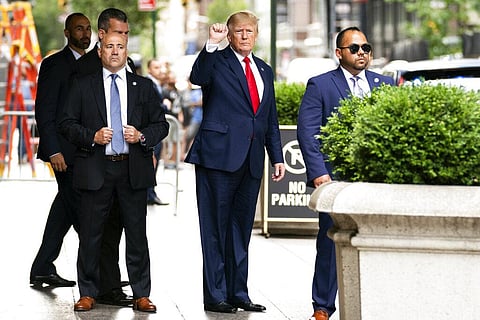 Former President Donald Trump gestures as he departs Trump Tower on Aug. 10, 2022, in New York, on his way to the New York attorney general's office for a deposition in a civil investigation. (Photo |