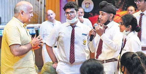 Deputy CM Manish Sisodia interacts with schoolchildren on Friday (Photo | Express)