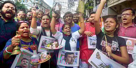 Activists of Trinamool Congress (TMC) stage a protest against central agencies ED and CBI, outside BJP office in Kolkata, Saturday, Aug. 13, 2022. (Photo |PTI)