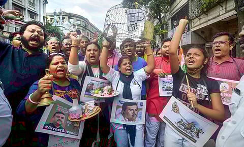 Activists of Trinamool Congress (TMC) stage a protest against central agencies ED and CBI, outside BJP office in Kolkata, Saturday. (Photo | PTI)