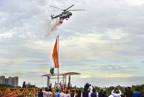 Helicopters shower flower petals during the function at the Red Fort. (Photo |PTI)