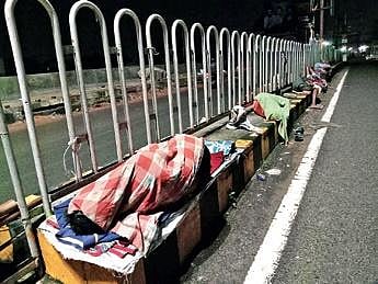 File photo of homeless persons sleeping on road median at Ranihat | Express
