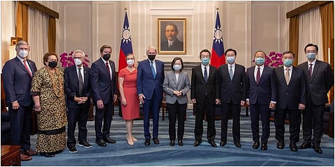 Taiwan's President Tsai Ing-wen pose for photos with US Congress members and other Taiwan officials during a meeting at the Presidential Office in Taipei. (Photo |AP)