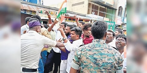 Police try to foil a clash between BJP and TRS activists in Devaruppula village (Photo | Special Arrangement)