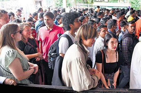 Visitors wait to buy tickets for the Independence Day Flower Show at Lalbagh in Bengaluru on Monday | Express