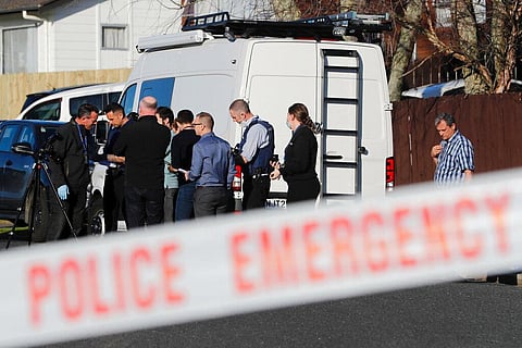 New Zealand police investigators work at a scene in Auckland after bodies were discovered in suitcases. (Photo | AP)