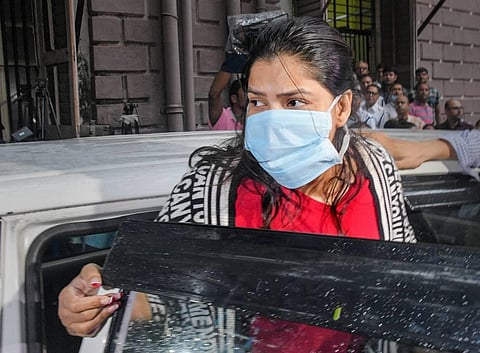 Arpita Mukherjee, close aide of West Bengal Minister Partha Chatterjee, being produced at a court a day after she was arrested by Enforcement Directorate. (Photo | PTI)