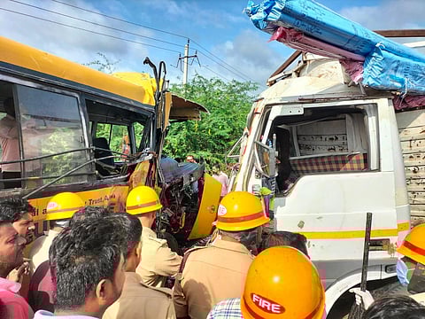 Fire fighters carrying out rescue operation from the damaged school bus in the accident.
