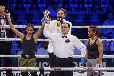 Somalia’s Ramla Ali (L) celebrates after winning the super bantamweight boxing match against Dominican Crystal Nova (R) in the Saudi Red Sea city of Jeddah, on August 20, 2022. (Photo | AFP)