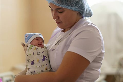 Alina Haupt, an intern-doctor, holds Veronika, a baby born prematurely at 29 weeks, at the Pokrovsk Perinatal Hospital in Pokrovsk, Donetsk region. (Photo | AP)