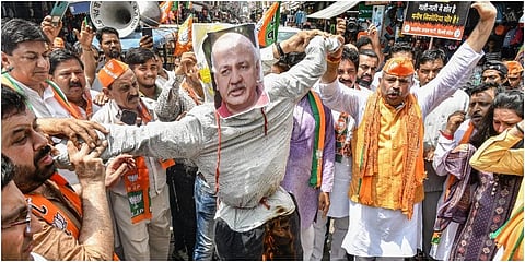 Delhi BJP President Adesh Gupta with party workers stages a protest demanding the resignation of Delhi Deputy CM Manish Sisodia over the alleged liquor policy scam. (Photo | PTI)