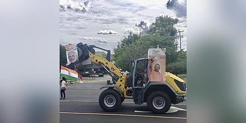 The bulldozer carried photos of Uttar Pradesh Chief Minister Adityanath and Prime Minister Narendra Modi and a placard with the words 'Baba ka bulldozer (Photo | Twitter)