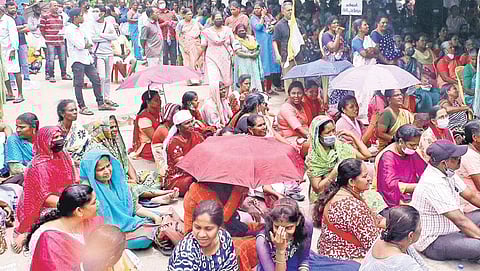 Women from coastal areas gather outside a tent erected in front of the Vizhinjam port gate. The protest was led by laity from Kannamthura, Kochuthoppu and Valiyathoppu on Wednesday | B P Deepu