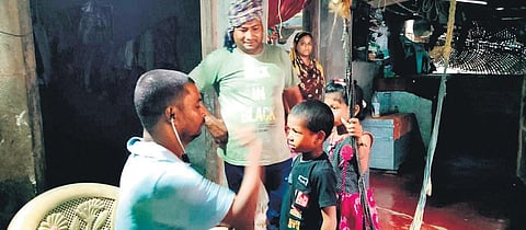 A health worker examining a child in a flood-affected village of Balasore | Express