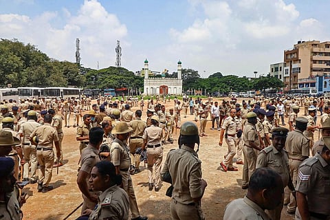 Police personnal deployed at the disputed Idgah Maidan, at Chamrajpet area in Bengaluru, Tuesday, Aug. 30, 2022. (Photo | PTI)