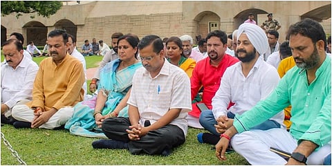 Delhi Chief Minister and AAP Convener Arvind Kejriwal with party MLAs pays tribute to Mahatma Gandhi, at Rajghat in New Delhi. (Photo | PTI)