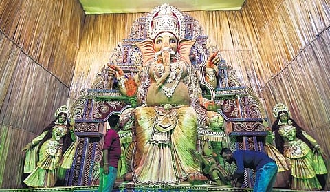 Artisans giving final touches to the idol at Saheed Nagar pandal | DEBADATTA MALLICK