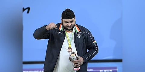 Indian weightlifter Gurdeep Singh with the bronze medal in the men's +109 kg weightlifting of the Commonwealth Games 2022 in Birmingham,UK. (Photo | PTI)