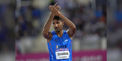 India's Tejaswin Shankar celebrates after taking the bronze medal in the men's high jump at CWG 2022.(Photo | AP)