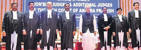 Governor Biswa Bhusan Harichandan with the newly appointed judges and additional judges of the AP High Court at the swearing-in ceremony. (Photo I Express)