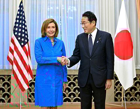 U.S. House Speaker Nancy Pelosi, left, shakes hands with Japanese Prime Minister Fumio Kishida at the prime minister's official residence in Tokyo. (Photo | AP)