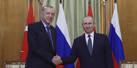 Turkish President Recep Tayyip Erdogan, left, and Russian President Vladimir Putin shake hands. (Photo | AP)