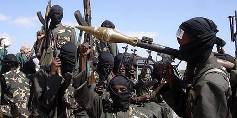 Armed al-Shabab fighters ride on pickup trucks as they prepare to travel into the city, just outside the capital Mogadishu, Somalia. (File Photo | AP)
