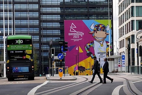 Pedestrians walk past a large hoarding displaying Perry, the official mascot of the Birmingham 2022 Commonwealth Games in Birmingham. (Photo | AP)