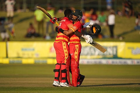 Zimbabwe batsman Sikandar Raza,right, and Innocent Kaia hug after both players scored 100 runs on the first day of the One-Day International match. (Photo | AP)