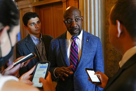 Sen. Raphael Warnock, D-Ga., speaks with reporters on Capitol Hill in Washington, Saturday, Aug. 6, 2022. (Photo |AP)