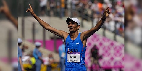 India's Sandeep Kumar reacts as he crosses the finish line in third place in the men's 10,000 meters walk.(Photo | AP)