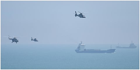 Chinese military helicopters fly past Pingtan island on August 4, 2022, ahead of massive military drills off Taiwan following US House Speaker Nancy Pelosi's visit. (Photo | AFP)