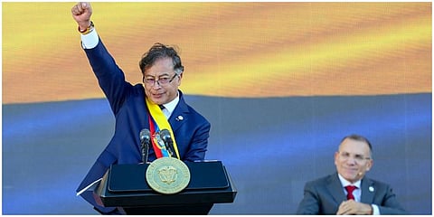 President Gustavo Petro raises his fist at the end of his inauguration speech in Bogota, Colombia. (Photo | AP)