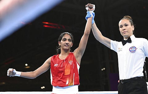 India's Nitu, left, celebrates after winning the Women's Minimum Weight quarter final boxing bout against Northern Ireland's Nicole Clyde. (Photo | AP)
