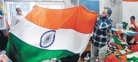 Workers manufacture national flags at a shop in Sadar Bazar ahead of Independence Day. The sale of national flags has increased immensely. (Photo | Shekhar Yadav)