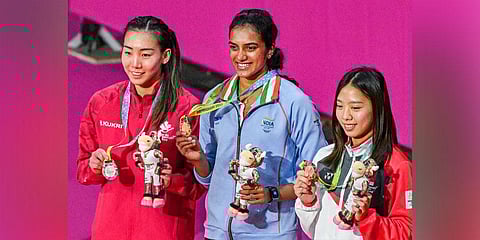 Gold medallist Indias P.V. Sindhu (C) with Silver medallist Canadas Michelle Li (L) and Bronze medallist Singapores Jia Min Yeo. (Photo | PTI)