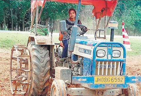 Manju Oran tills her farm at Dahu Toli in Gumla district of Jharkhand. (Photo | EPS)
