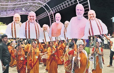 BJP workers waiting outside the airport to receive Amit Shah on Sunday | Express