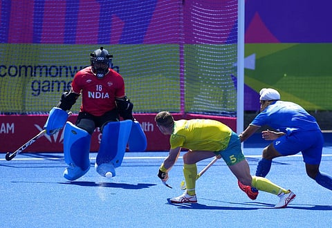 Australia's Tom Wickham, center, makes an attempt on goal during the men's final hockey match between Australia and India at the Commonwealth Games. (Photo | AP)