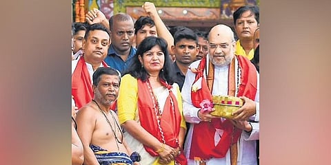 Amit Shah with State BJP leaders during his visit to Lingaraj temple in Bhubaneswar on Monday | express