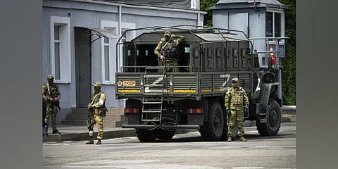 Russian soldiers guard an area as a group of foreign journalists visit in Kherson, Kherson region, south Ukraine. (Photo | AP)