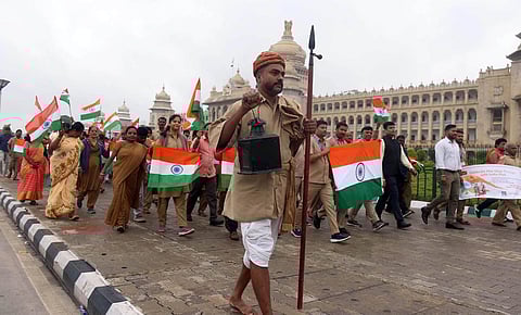 Postal staffers take out a roadshow in Bengaluru. (Photo | Express)
