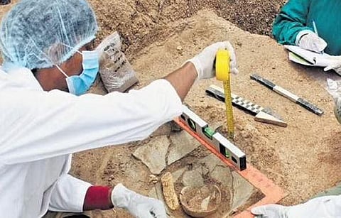 Archaeologists checking the Carnelian beads at found from Konthagai | Express