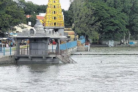 The bathing ghat at Nimishamba temple near Srirangapatna gets flooded, as over 97,969 cusecs of water was released from the Krishnaraja Sagar reservoir in Mandya district on Monday | Udayashankar S